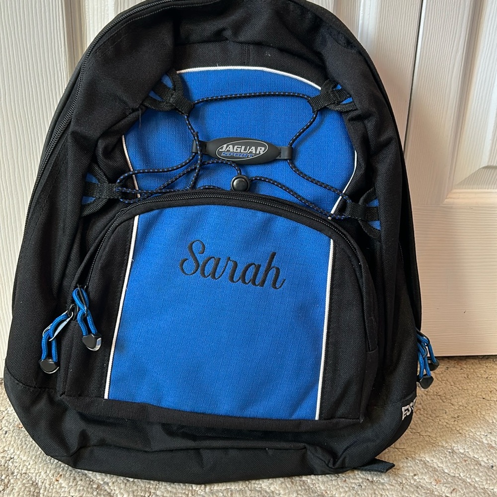 black/blue backpack with name engraved.